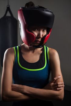 Determined woman wearing headgear during boxing