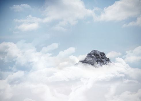 Mountain peak through the clouds