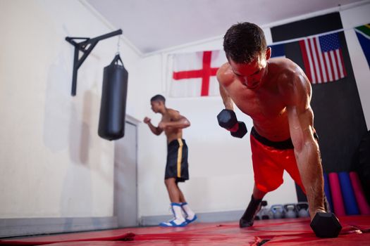 Men exercising in fitness studio