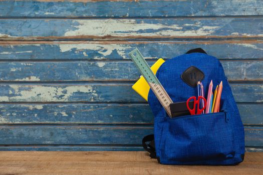 Schoolbag on wooden background
