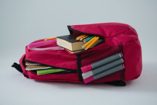 Various school supplies in schoolbag