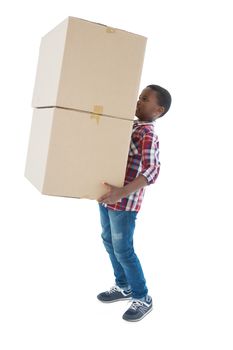 Boy carrying heavy boxes