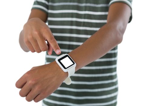 Teenage boy operating his smartwatch