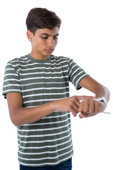 Teenage boy operating his smartwatch