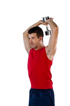 Determined sports player exercising with dumbells