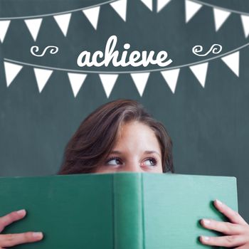 The word achieve and bunting against student holding book