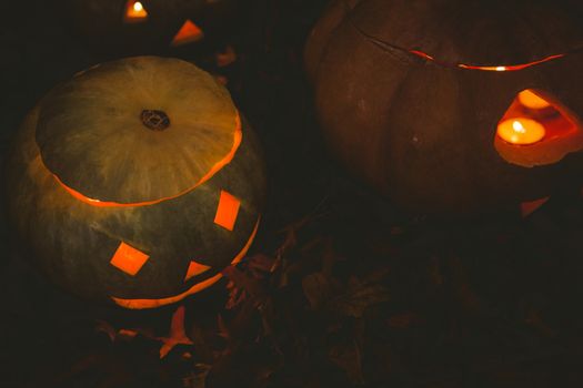 Jack o lantern glowing in darkroom during Halloween