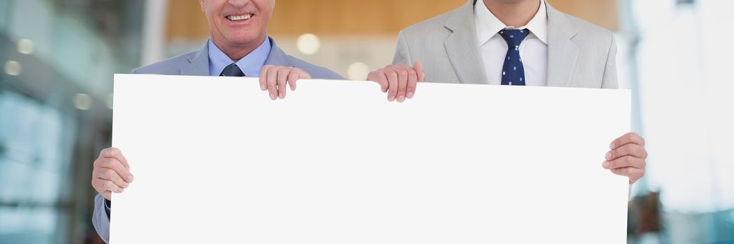 Business men holding a blank card
