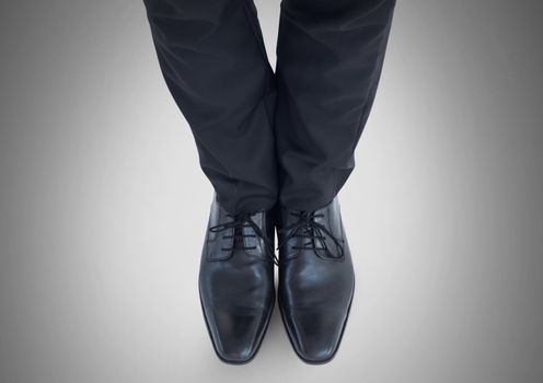 Businessman feet and legs with business attire and black shoes
