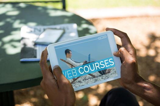 Person holding a tablet with e-learning information in the screen