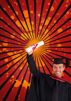 Happy young student man holding a diploma against red, black and orange splattered background