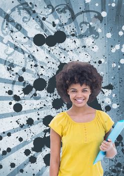 Happy young student woman holding a folder against blue splattered background