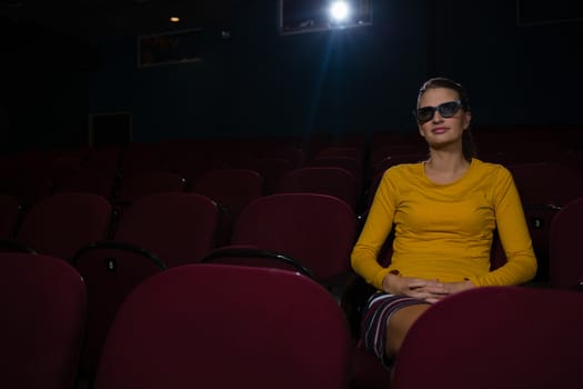 Woman in 3d glasses watching movie