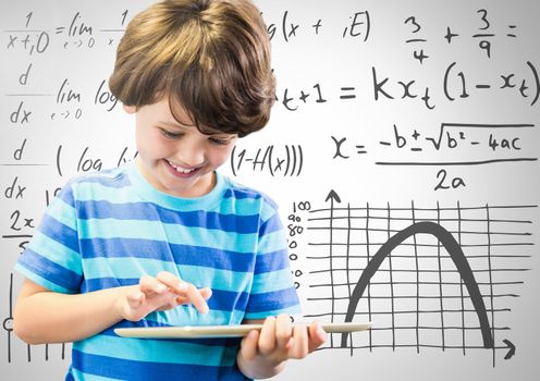 Boy on tablet with math equations background