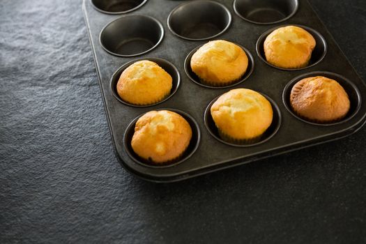 Plain cupcakes in baking tray