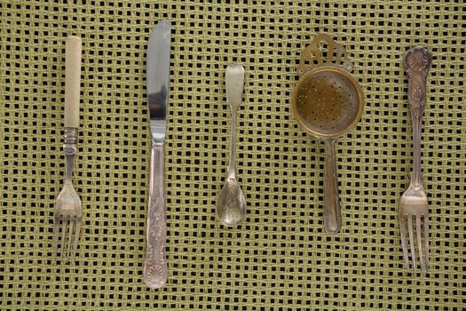 Spoons, fork, butter knife and strainer