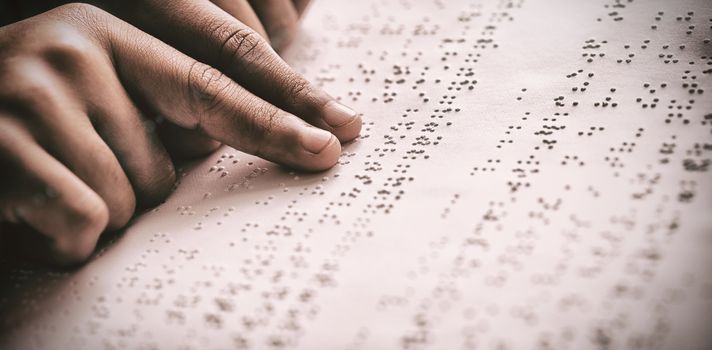 Child using braille to read