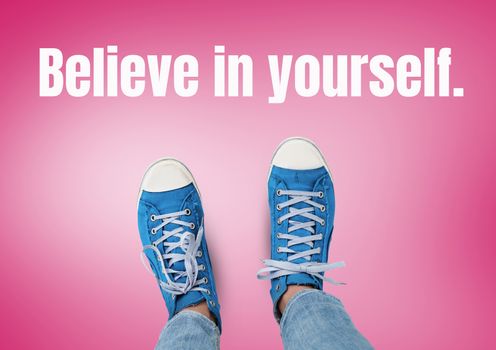 Believe in yourself text and Blue shoes on feet with red background