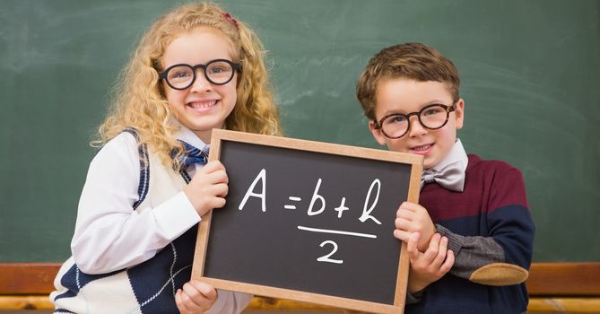 Children holding blackboard with math equation