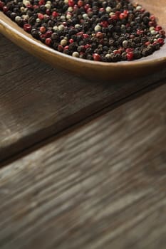 Mix peppercorns in wooden bowl