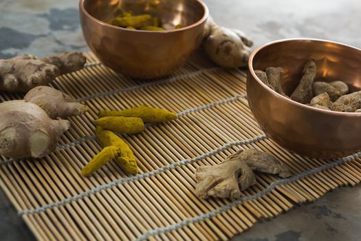 Ginger and turmeric stick on bamboo placemat