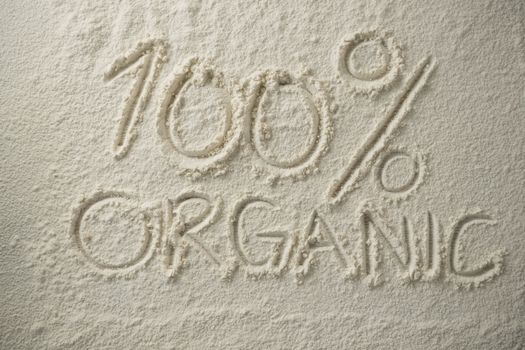 Oraganic text with 100 percentage sign on flour
