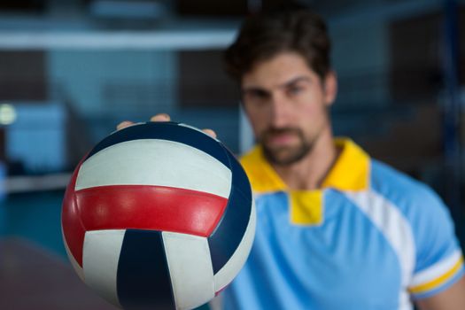 Male sportsperson holding volleyball