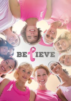 Believe text with breast cancer awareness women together