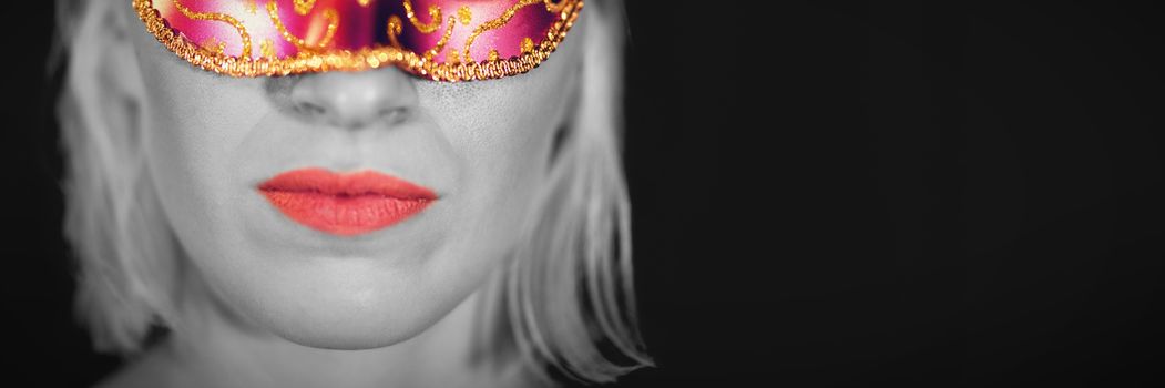 Close-up portrait of woman in masquerade mask