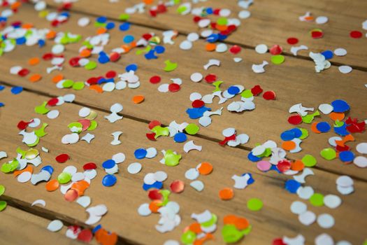 Confetti on wooden surface