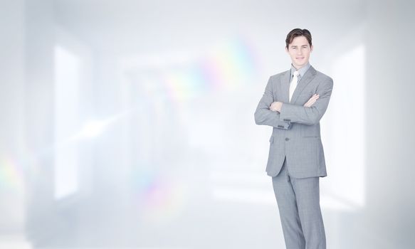 Composite image of assertive businessman standing 