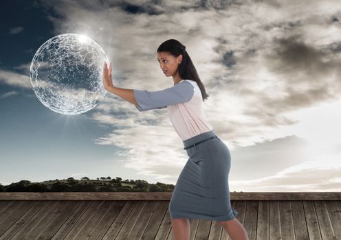 Businesswoman pushing glowing orb sphere