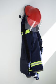 Protective workwear hanging on hook