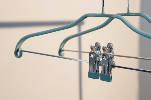 Empty cloth hanger with clothes peg