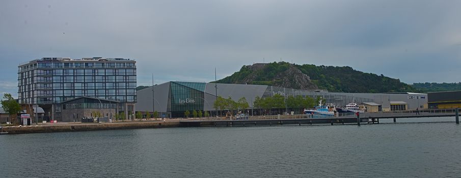 CHERBOURG, FRANCE - June 6th 2019 - Pier with dock and modern building at shore