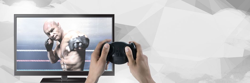Hands holding gaming controller  with mixed martial arts fighter on television