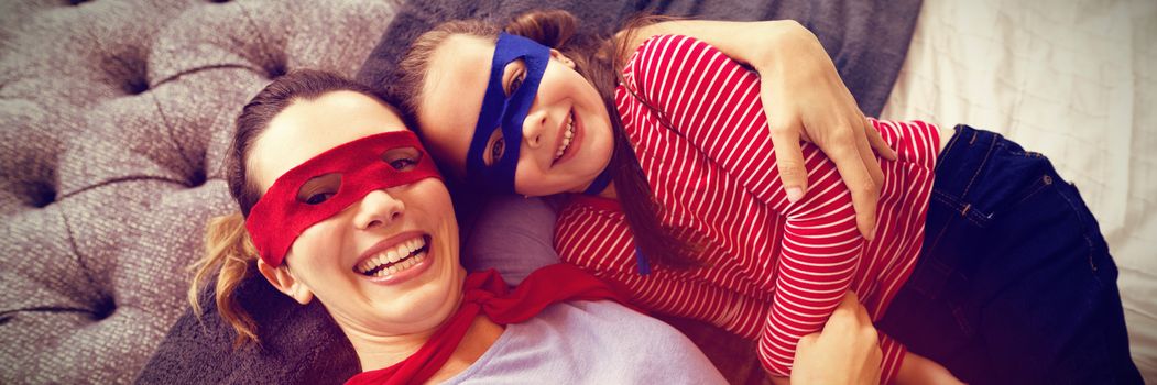 Mother and daughter playing super heroes