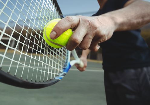 Tennis player holding racket on court with racket