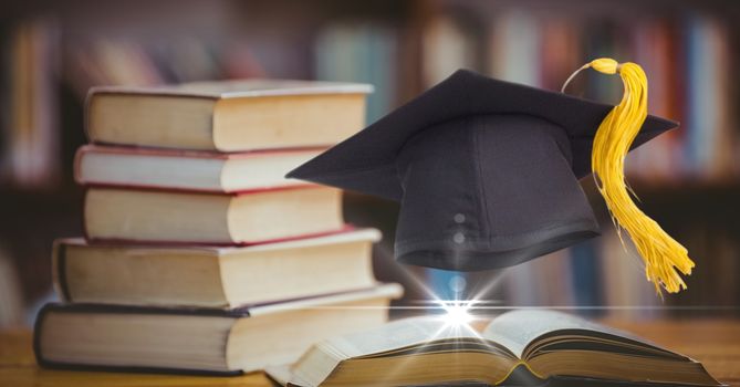 Composed image of academic hat with books