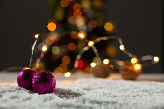 Christmas balls against unfocused tree