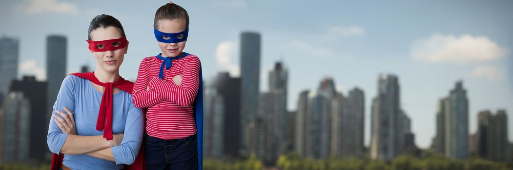 Composite image of mother and daughter pretending to be superhero