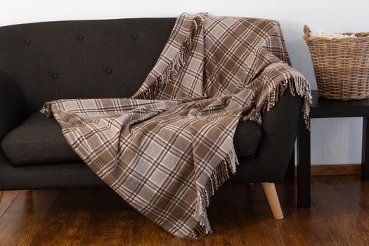 Blanket arranged on sofa