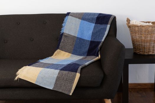 Blanket arranged on sofa