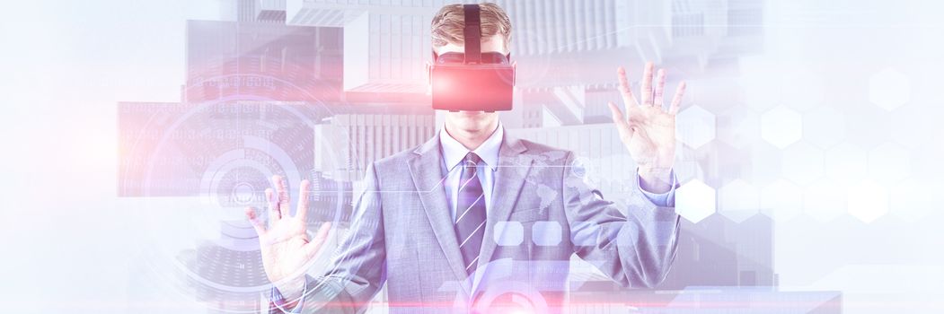 Composite image of businessman using virtual reality headset