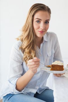Pretty blonde having cake and coffee