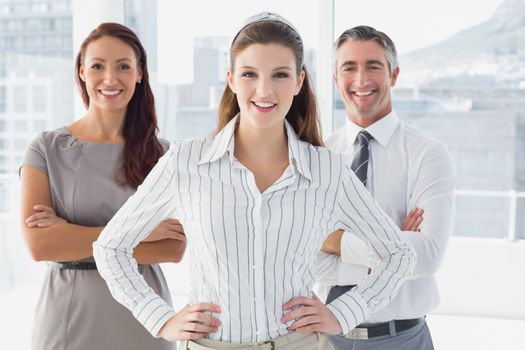Smiling businesswoman with hand on hip