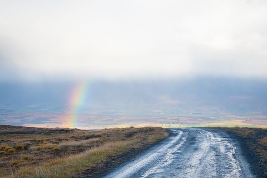 Mountain pass towards Akureyri in Iceland rainbow appearing in valley