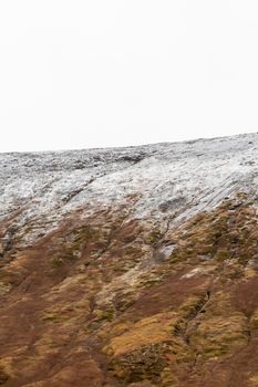 Snow line on mountain slope in Iceland close to Westfjords