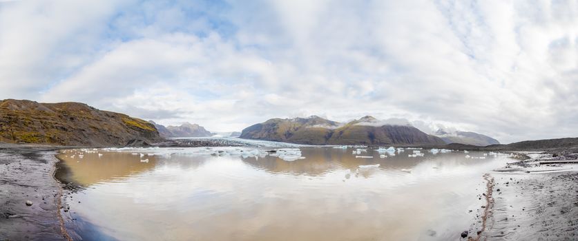 Vatnajoekull glacier in Iceland panorama of glacier lake ice floes floating around