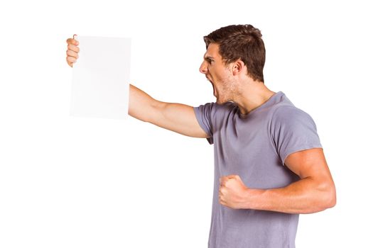 Angry man shouting at piece of paper